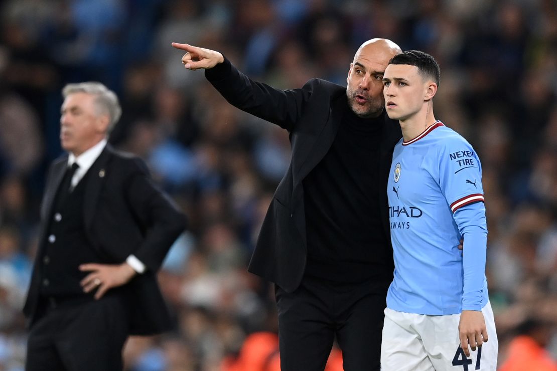 MANCHESTER, ENGLAND - MAY 17: Pep Guardiola gives instructions to Phil Foden of Manchester City during the UEFA Champions League semi-final second leg match between Manchester City FC and Real Madrid at Etihad Stadium on May 17, 2023 in Manchester, England. (Photo by Michael Regan/Getty Images)