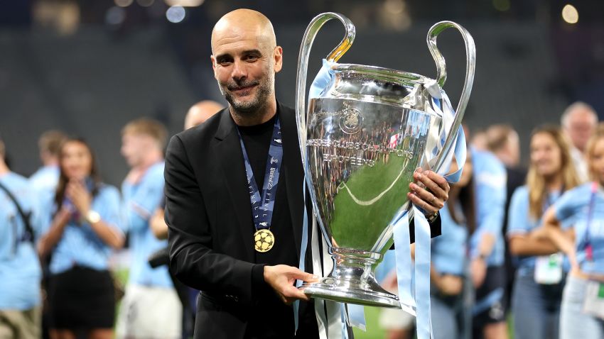 ISTANBUL, TURKEY - JUNE 10: Pep Guardiola, Manager of Manchester City, celebrates with the UEFA Champions League trophy after the team's victory during the UEFA Champions League 2022/23 final match between FC Internazionale and Manchester City FC at Ataturk Olympic Stadium on June 10, 2023 in Istanbul, Turkey. (Photo by Catherine Ivill/Getty Images)