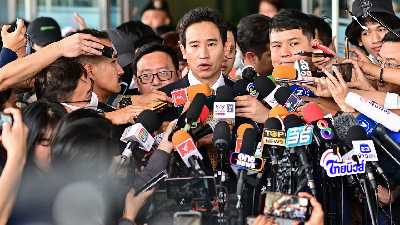 Former Thai prime ministerial candidate and ex-Move Forward Party leader Pita Limjaroenrat (C) speaks to the media outside the Constitutional Court in Bangkok on January 24, 2024, after the court decided to reinstate him as a lawmaker.