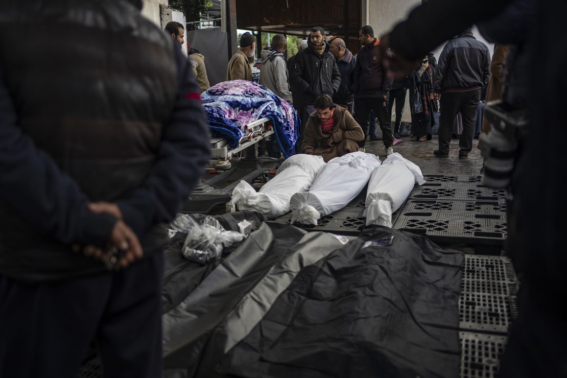 Palestinians gather around the bodies of those who were killed in the Israeli ground offensive and bombardment of Khan Younis, outside a morgue in Rafah, southern Gaza, Wednesday, Jan. 24, 2024. (AP Photo/Fatima Shbair)