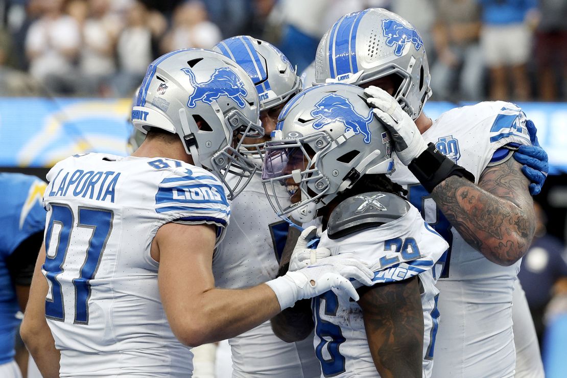 INGLEWOOD, CALIFORNIA - NOVEMBER 12: Jahmyr Gibbs #26 of the Detroit Lions celebrates a touchdown with teammates during the first half against the Los Angeles Chargers at SoFi Stadium on November 12, 2023 in Inglewood, California. (Photo by Kevork Djansezian/Getty Images)