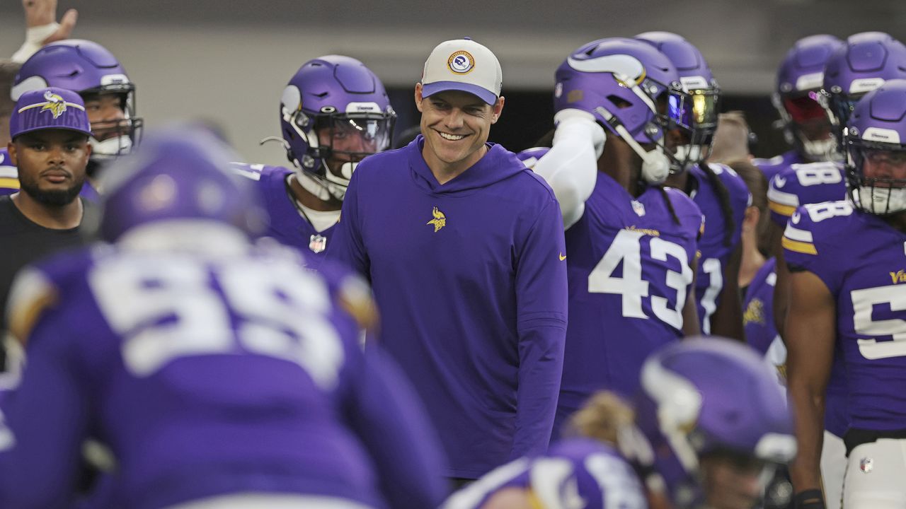Minnesota Vikings head coach Kevin O'Connell smiles with players during warm ups before an NFL football game against the Tennessee Titans, Saturday, Aug. 19, 2023 in Minneapolis. (AP Photo/Stacy Bengs)
