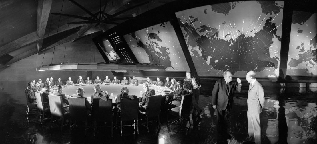 14th March 1963:  Filming on the set of 'Dr Strangelove or: How I Learned to Stop Worrying and Love the Bomb' directed by Stanley Kubrick. From right to left : Peter Sellers (1925 - 1980) as US President Merkin Muffley, Peter Bull (1912 - 1984) as Ambassador de Sadesky and George C Scott (1927 - 1999) as General 'Buck' Turgidson.