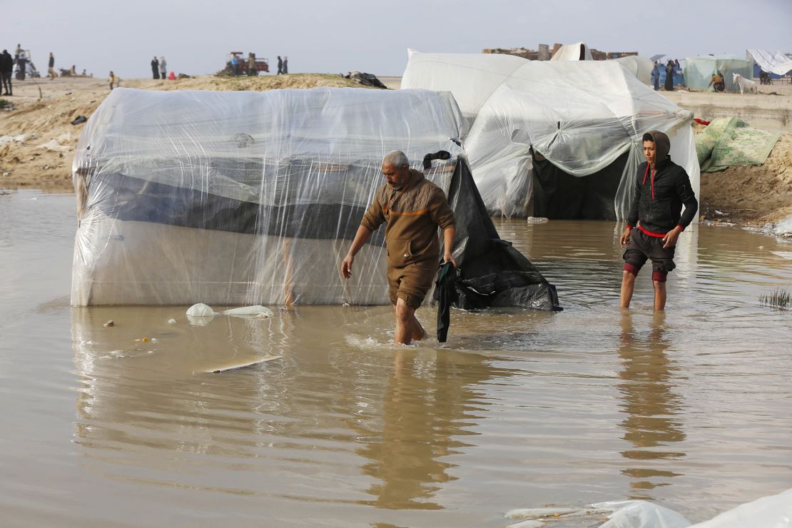DEIR AL BALAH, GAZA - JANUARY 24: Heavy rain floods Palestinian migrants' tents in Deir al Balah, Gaza on January 24, 2024. (Photo by Ashraf Amra/Anadolu via Getty Images)