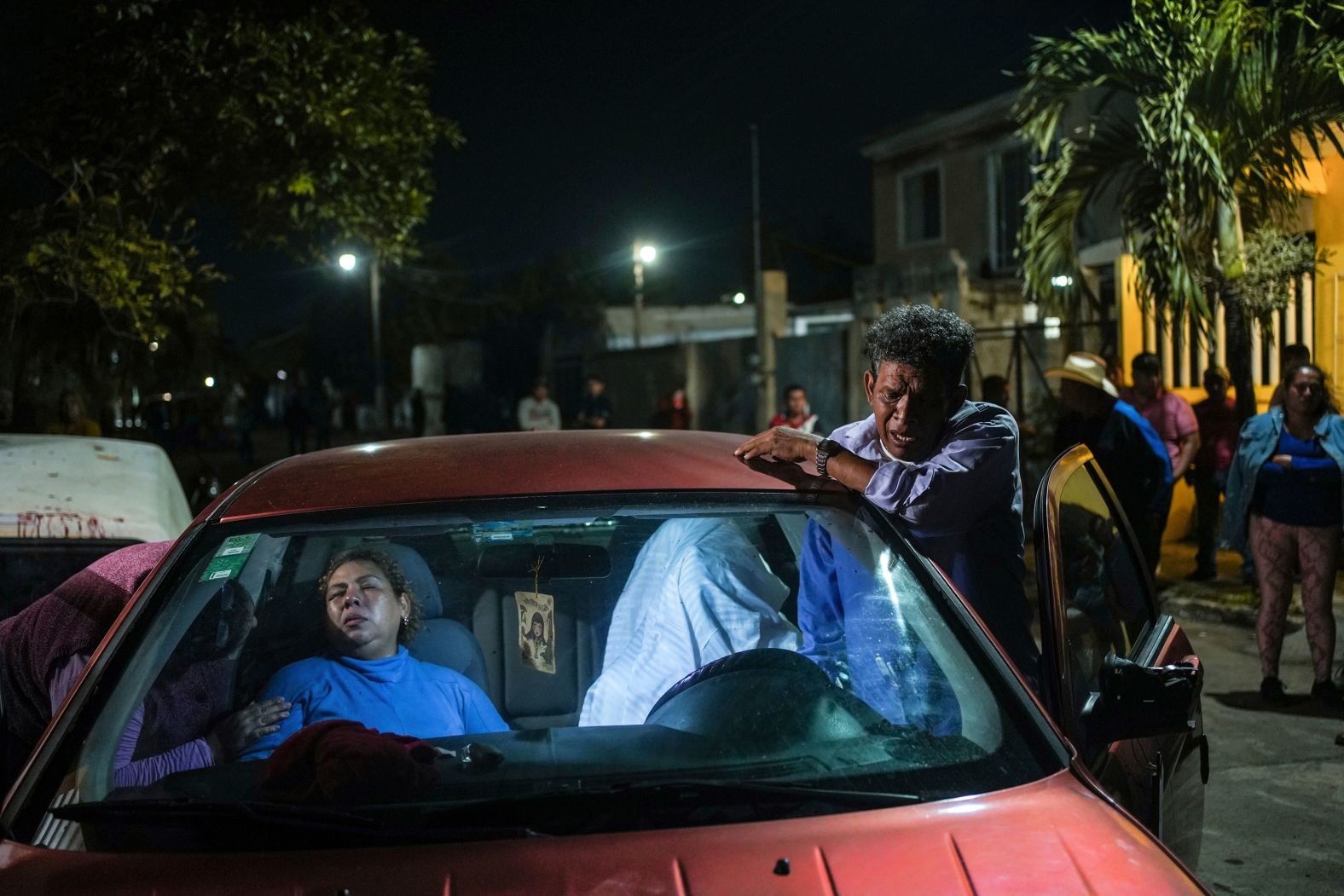 The parents of Brando de Jesús Arellano Cruz grieve next to his body after he was fatally shot by police while in his vehicle in Lerdo de Tejada, Mexico, on Friday, January 19. Four police officers were placed under investigation after people in the town surrounded the officers and attacked them, <a href="index.php?page=&url=https%3A%2F%2Fapnews.com%2Farticle%2Fmexico-police-shooting-death-investigation-dc25c24a84069090d6953f1008f69891" target="_blank" target="_blank">according to the Associated Press</a>.