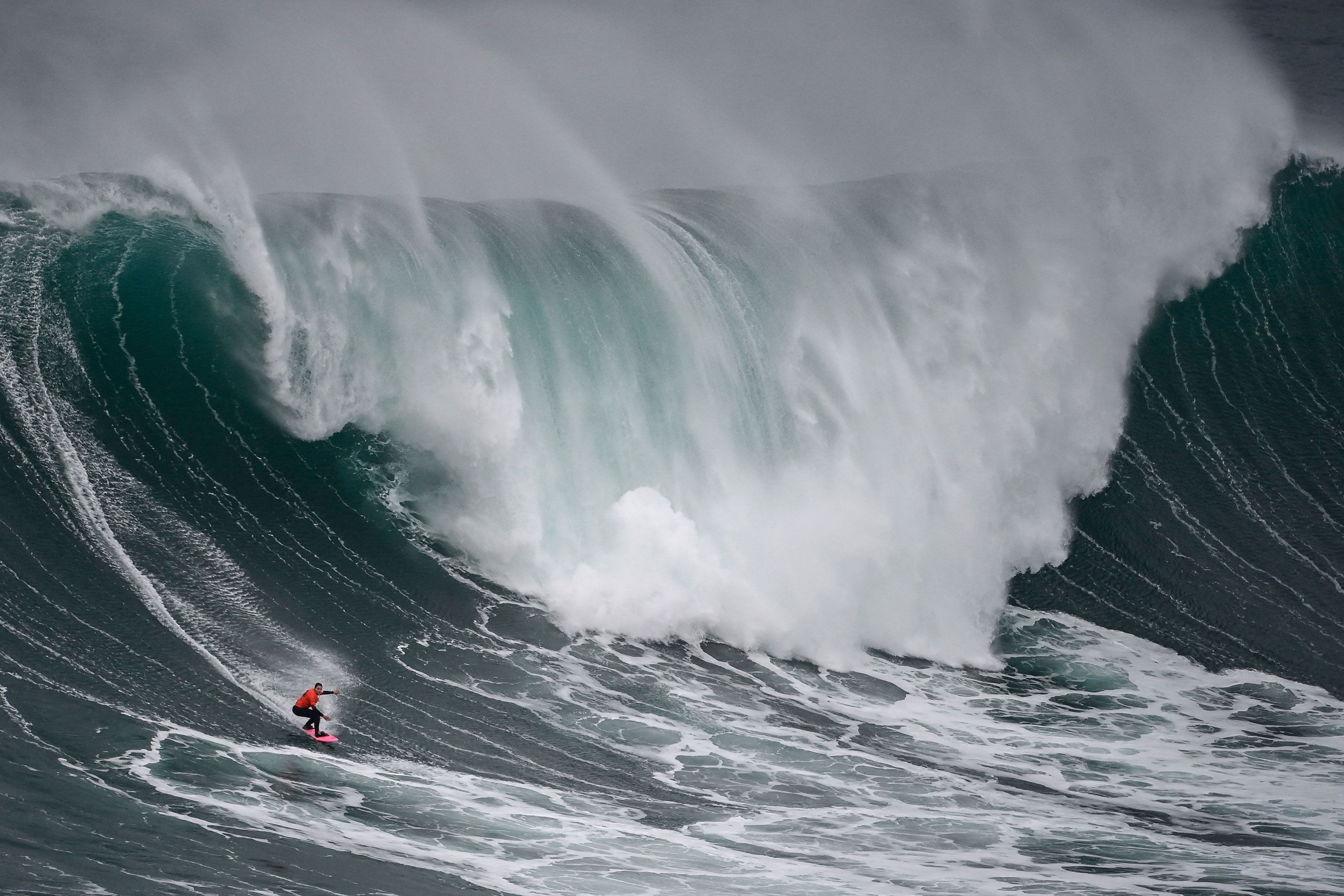 Brazilian surfer Maya Gabeira rides a wave in Nazaré, Portugal, during the World Surf League's Nazaré Big Wave Challenge on Monday, January 22. Gabeira won the women's competition, and her compatriot Lucas Chianca won the men's competition.