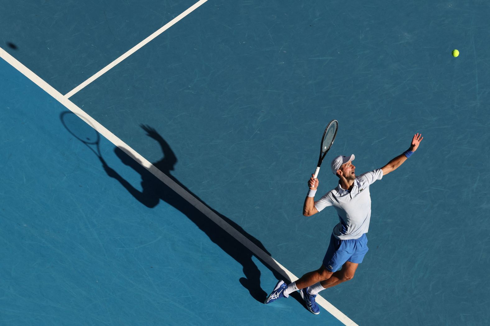Novak Djokovic serves against Taylor Fritz during their Australian Open quarterfinal match on Tuesday, January 23. <a href="index.php?page=&url=https%3A%2F%2Fwww.cnn.com%2F2024%2F01%2F23%2Fsport%2Fnovak-djokovic-taylor-fritz-australian-open-spt-intl%2Findex.html" target="_blank">Djokovic won in four sets</a> to continue his pursuit of a record-breaking 25th grand slam title.