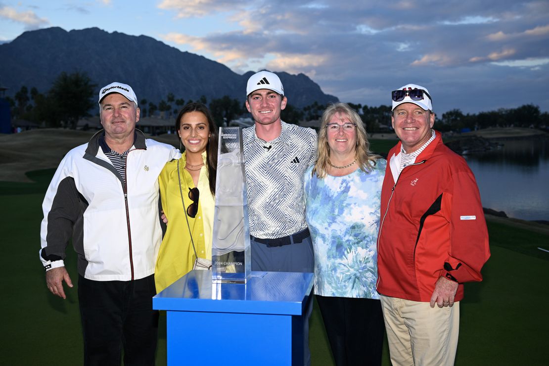 LA QUINTA, CALIFORNIA - JANUARY 21: Nick Dunlap of the United States poses for a photo with the trophy alongside parents Charlene and Jim, Girlfriend Isabella Ellis and Coach Jay Seawell after winning The American Express at Pete Dye Stadium Course on January 21, 2024 in La Quinta, California. (Photo by Orlando Ramirez/Getty Images)