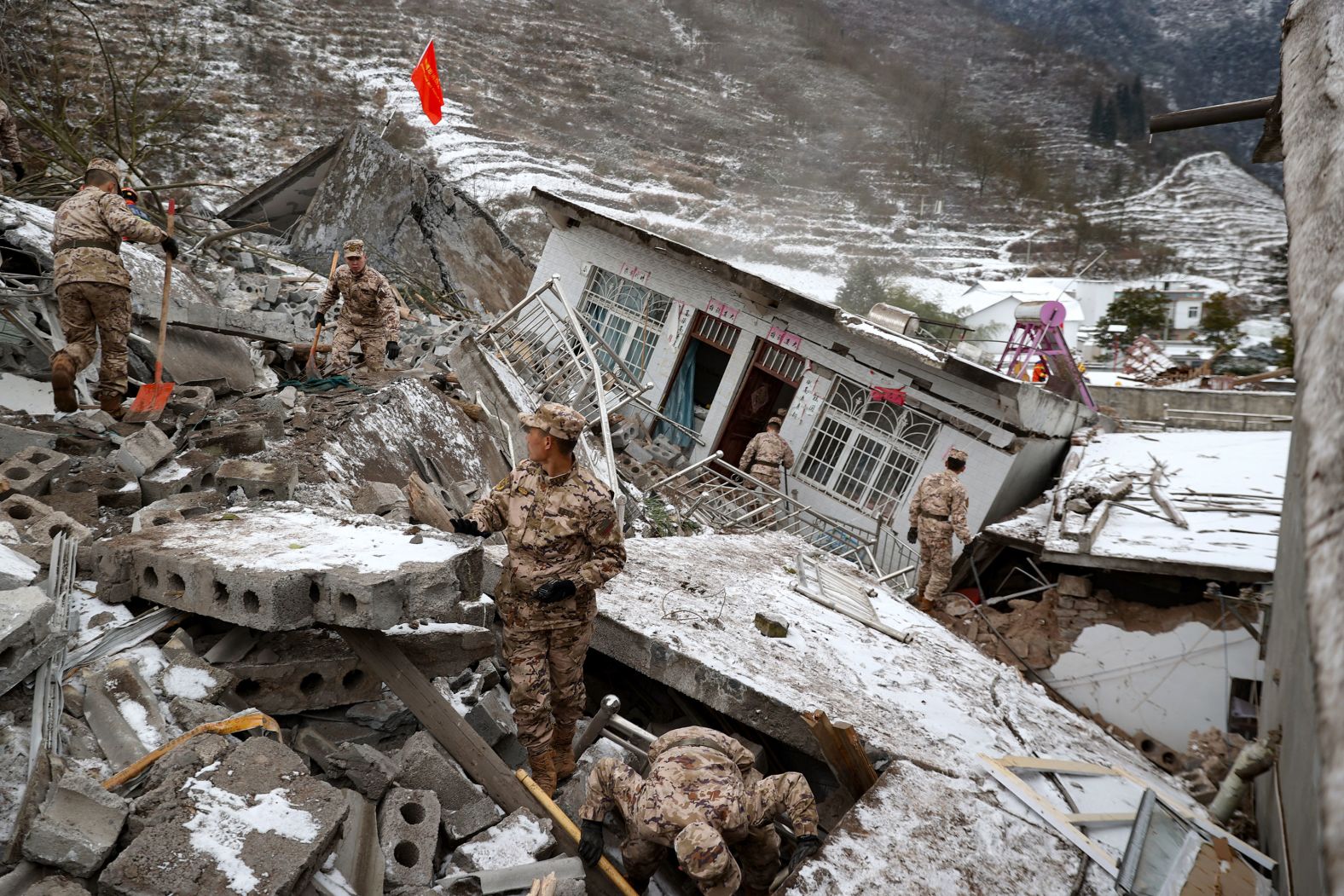 Military personnel search for missing victims Monday, January 22, following a landslide in the Chinese village of Liangshui. <a href="index.php?page=&url=https%3A%2F%2Fwww.cnn.com%2F2024%2F01%2F22%2Fchina%2Fchina-yunnan-landslide-intl-hnk%2Findex.html" target="_blank">The landslide</a> buried 18 homes and dozens of people.