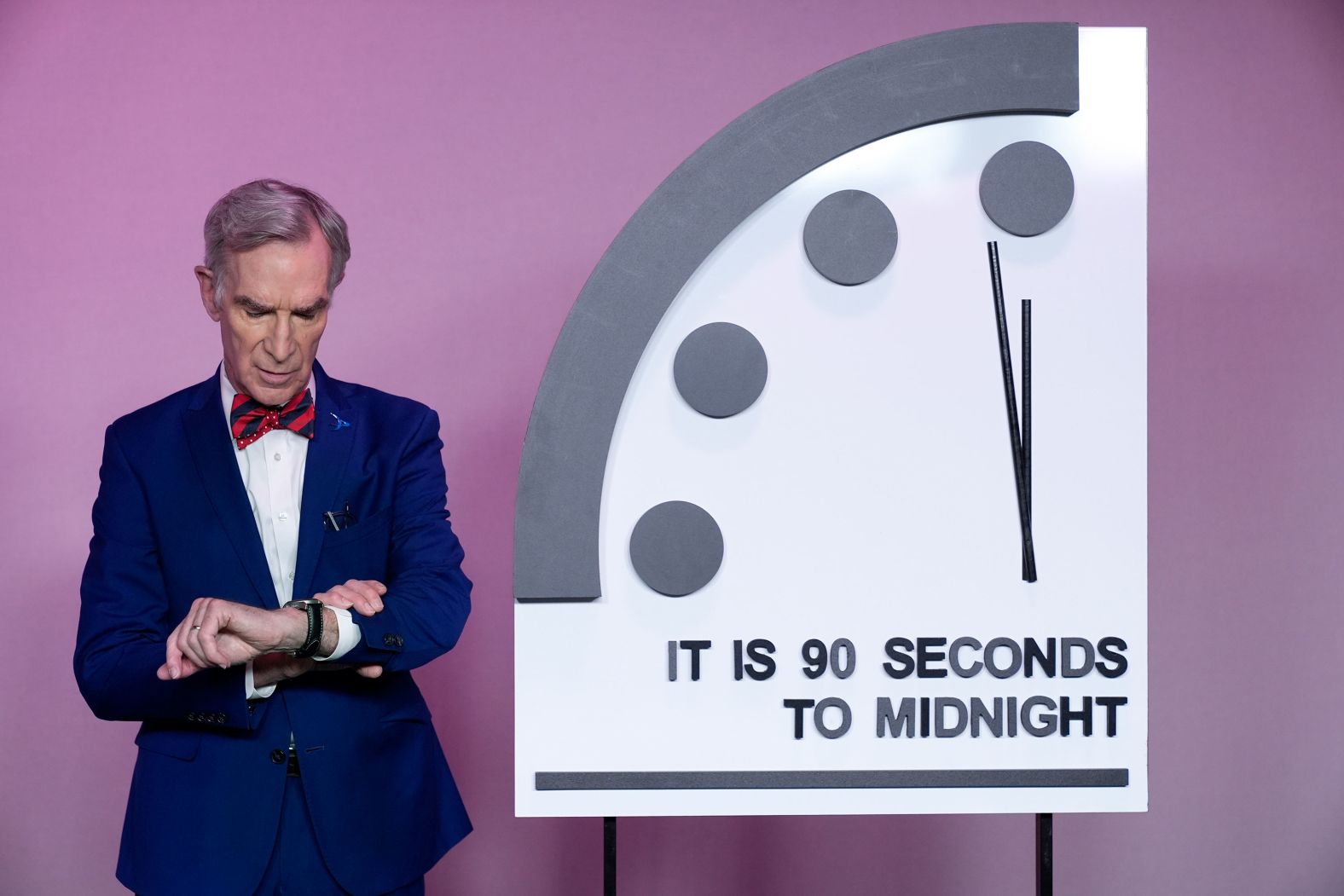 Science educator Bill Nye looks at his watch next to the Doomsday Clock at an event in Washington, DC, on Tuesday, January 23. On Tuesday, <a href="index.php?page=&url=https%3A%2F%2Fwww.cnn.com%2F2024%2F01%2F23%2Fworld%2Fdoomsday-clock-2024-climate-scn%2Findex.html" target="_blank">the clock was again set at 90 seconds to midnight</a> — the closest to the hour it has ever been, according to the Bulletin of the Atomic Scientists, which created the clock in 1947. Midnight represents the moment at which people will have made Earth uninhabitable.