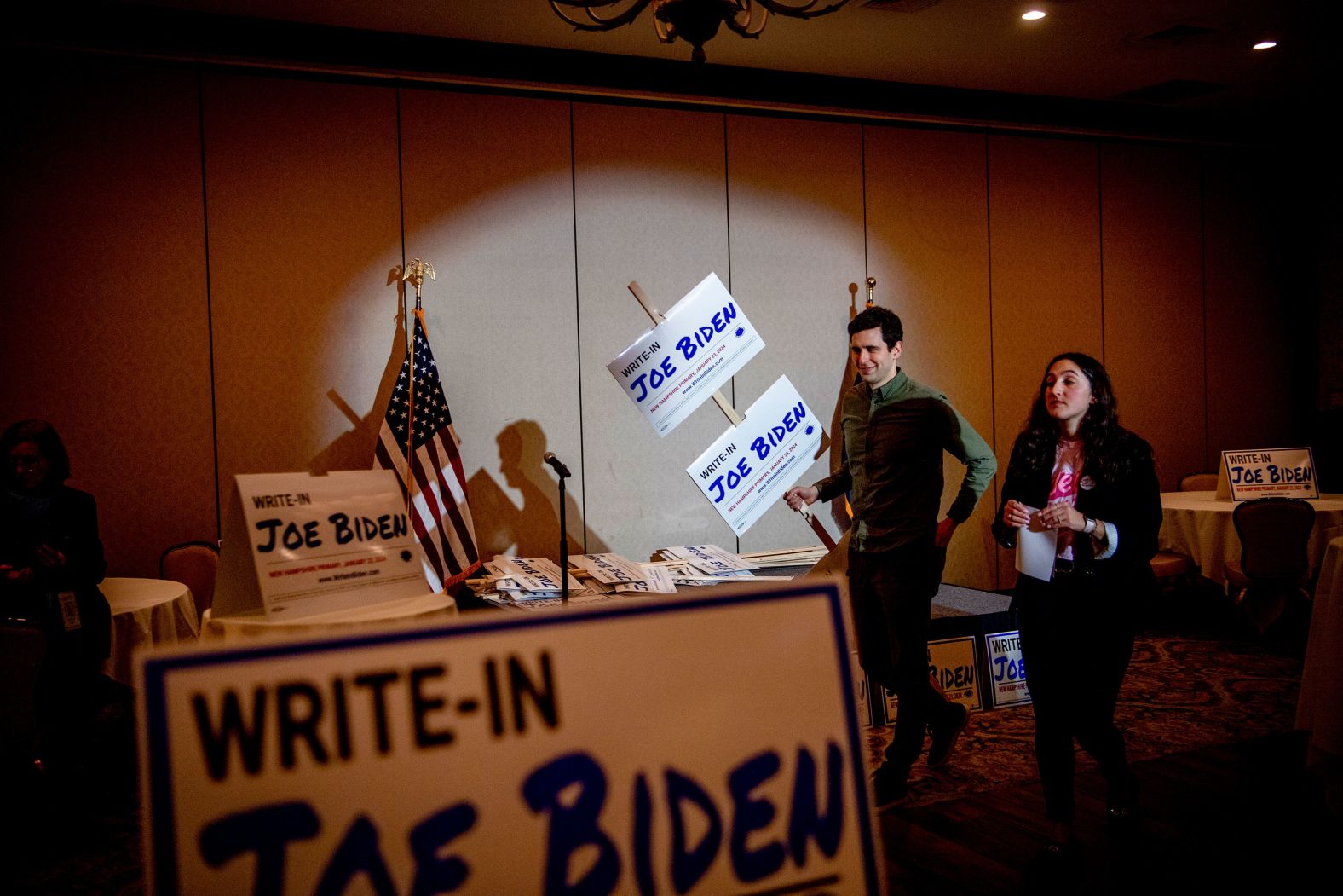 Supporters of a write-in campaign for US President Joe Biden gather for an election night watch party in Manchester, New Hampshire, on Tuesday, January 23. Biden was not among the 21 candidates listed on the ballot after New Hampshire defied the primary calendar set by the national Democratic Party. Despite not being on the ballot, <a href="index.php?page=&url=https%3A%2F%2Fwww.cnn.com%2F2024%2F01%2F23%2Fpolitics%2Fbiden-new-hampshire-primary%2Findex.html" target="_blank">Biden still won the primary</a>.