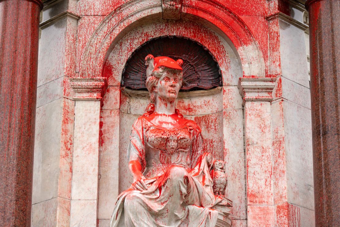 A Queen Victoria monument in Melbourne, Australia, is doused with red paint Thursday, Jan. 25, 2024. 
