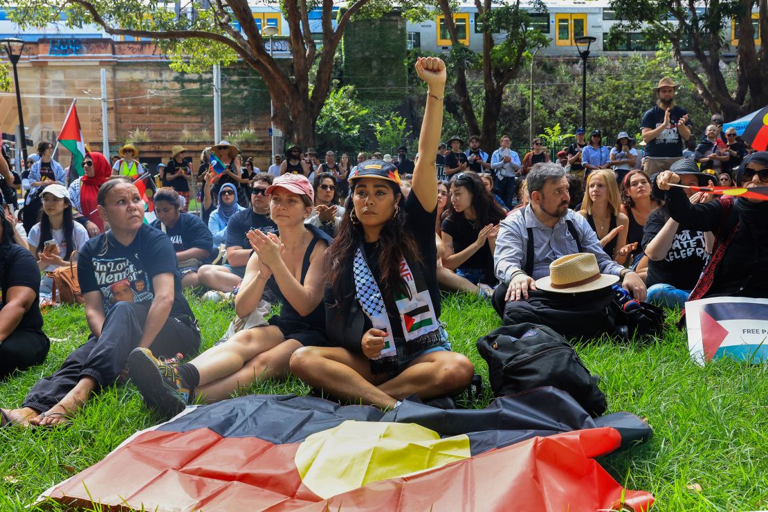 Protesters carried the Aboriginal flag as Indigenous leaders spoke about the injustices inflicted through colonization.