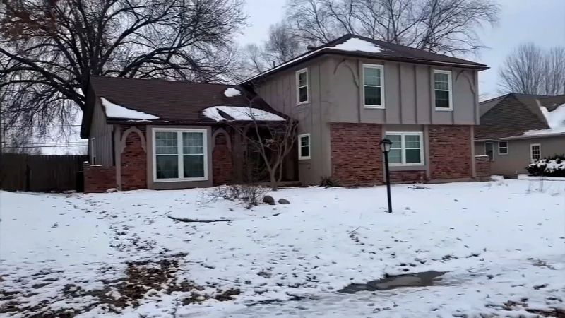 The men's bodies were found in the back yard of this house in northern Kansas City.
