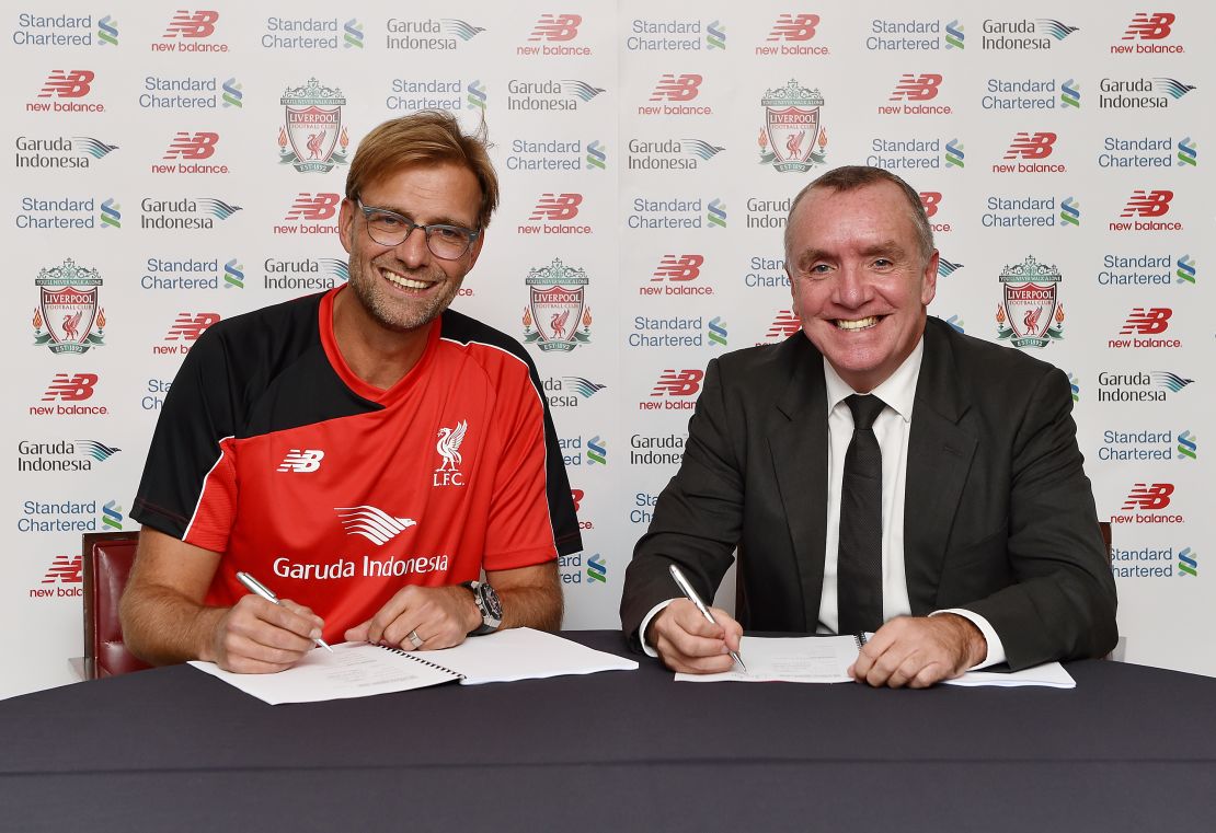 New Manager of Liverpool Jurgen Klopp signs his new contract to manage Liverpool with Ian Ayre chief executive officer of Liverpool Football on October 8, 2015 in Liverpool, England.