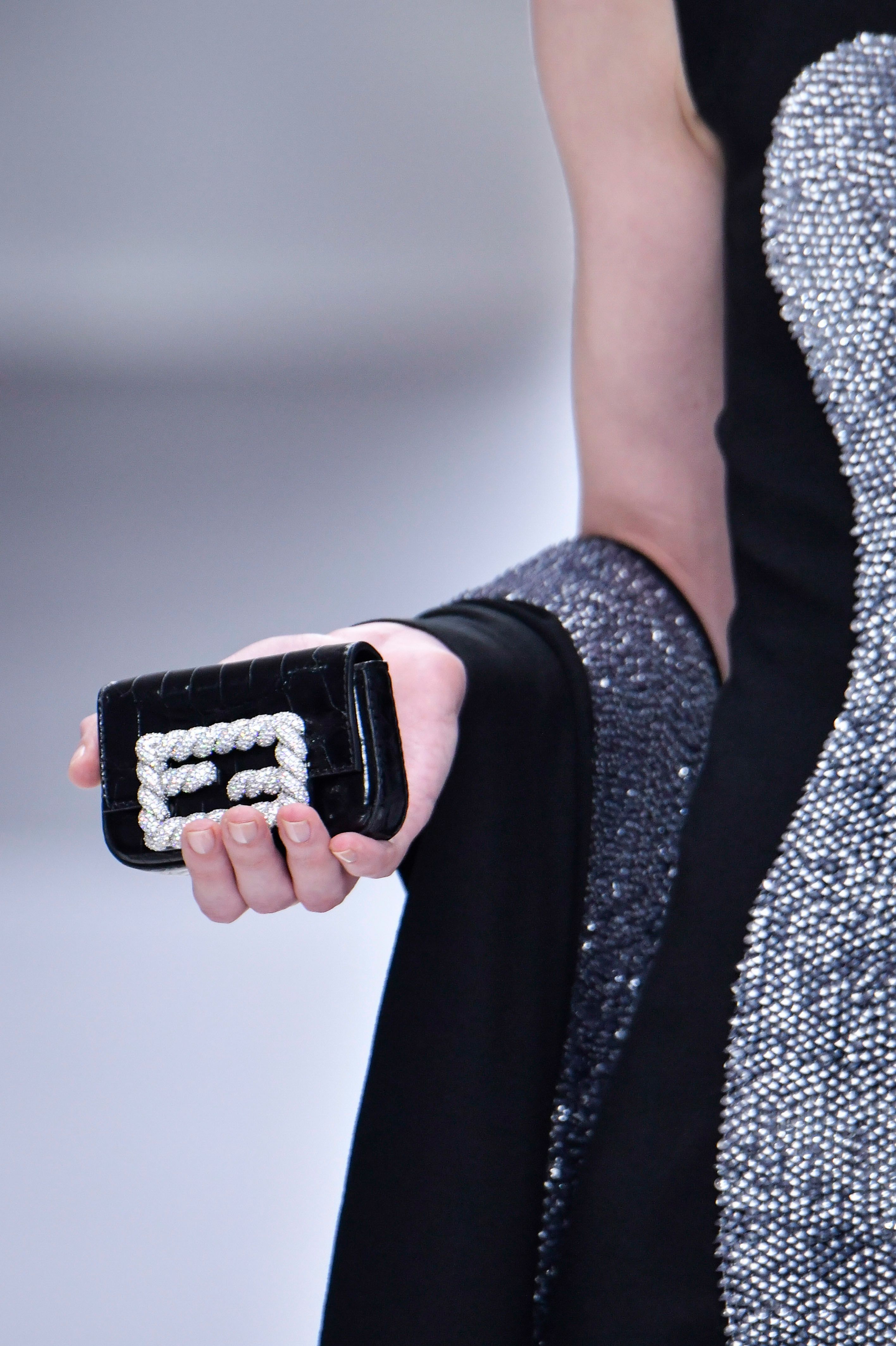 Fendi's mini Baguette bags made their debut, featuring elaborate detailing.