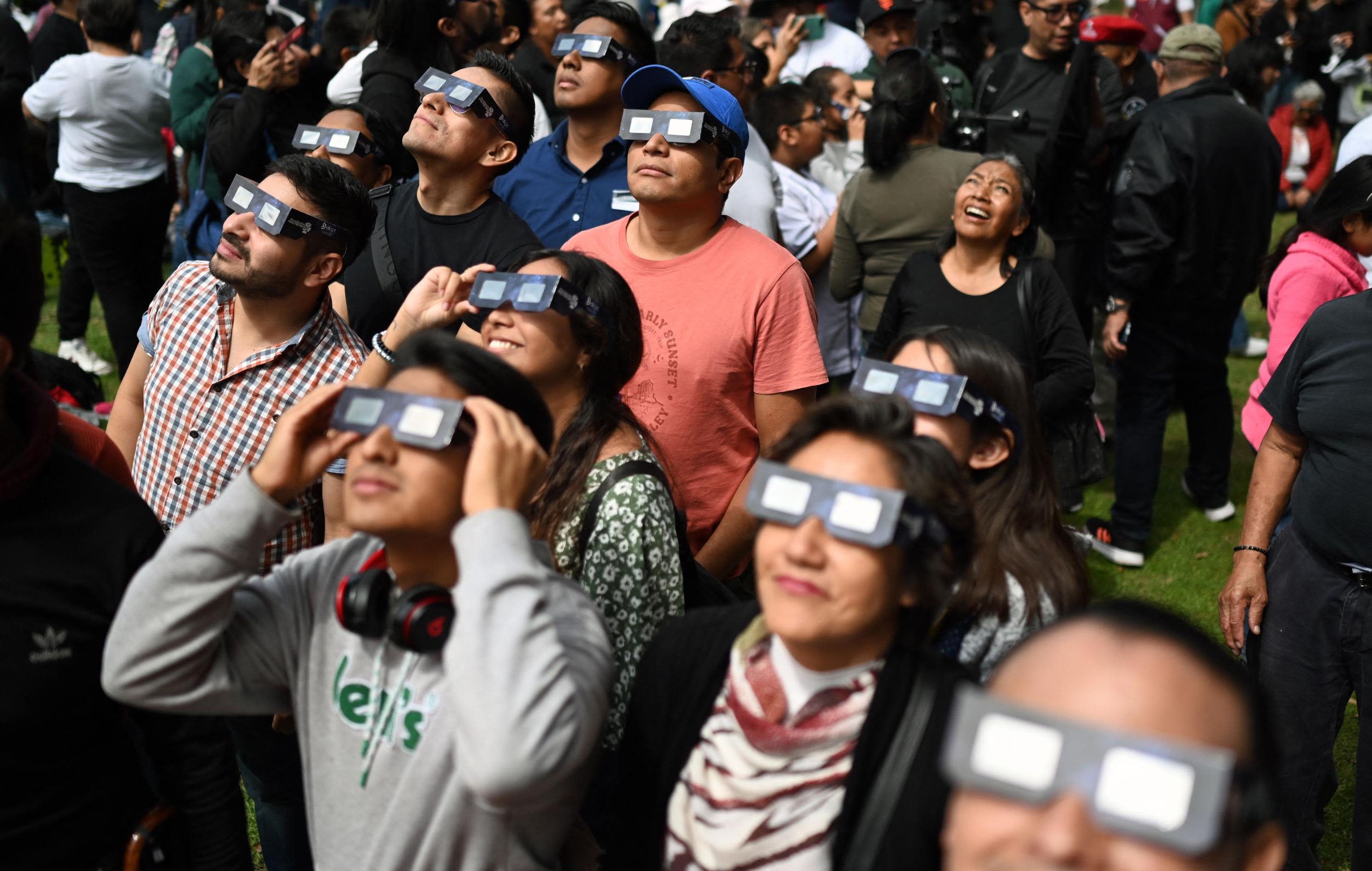 A crowd of people watch the annular solar eclipse at the Luis Enrique Erro Planetarium of the National Polytechnic Institute in Mexico City on October 14, 2023.<span>&nbsp;</span><span class="credit">Alfredo Estrella/AFP/Getty Images</span>