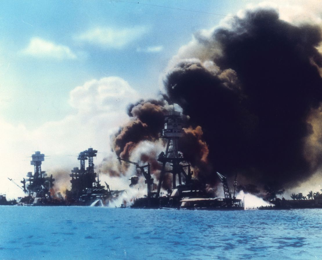 View of battleship row as explosions damage three American battleships during the Japanese attack on Pearl Harbor, Honolulu, Oahu, Hawaii, December 7, 1941. From left to right, the USS West Virginia, the USS Tennessee, and the USS Arizona.