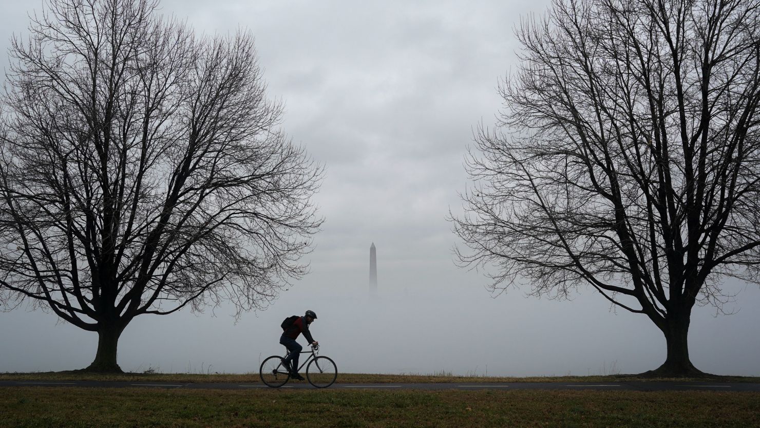The top of the Washington Monument is seen above fog blanketing the Potomac River on an unseasonably warm day in Washington, U.S., January 25, 2024. REUTERS/Kevin Lamarque