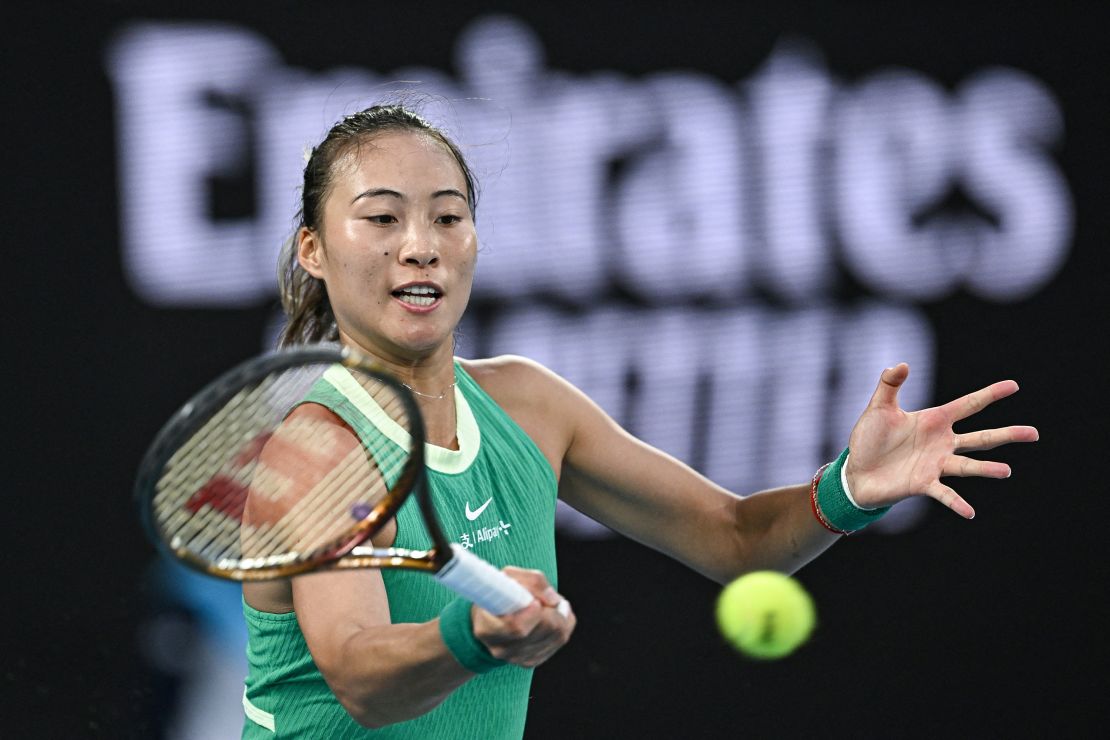 China's Zheng Qinwen hits a return against Belarus' Aryna Sabalenka during their women's singles final match on day 14 of the Australian Open tennis tournament in Melbourne on January 27, 2024. (Photo by Lillian SUWANRUMPHA / AFP) / -- IMAGE RESTRICTED TO EDITORIAL USE - STRICTLY NO COMMERCIAL USE -- (Photo by LILLIAN SUWANRUMPHA/AFP via Getty Images)