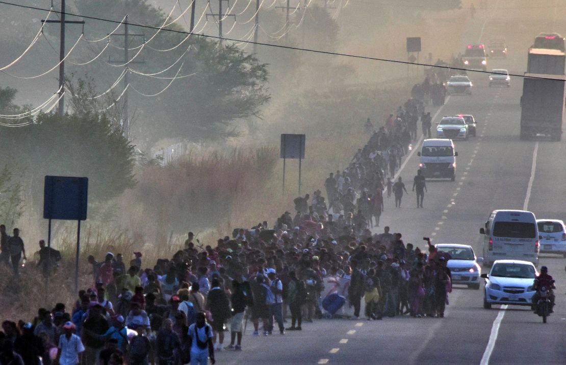 Migrants take part in a caravan towards the border with the United States in Arriaga community, Chiapas State, Mexico, on January 8, 2024. More than a thousand migrants of different nationalities have resumed their passage in the caravan after not receiving a favorable response to their demands to receive humanitarian visas from the National Migration Institute.