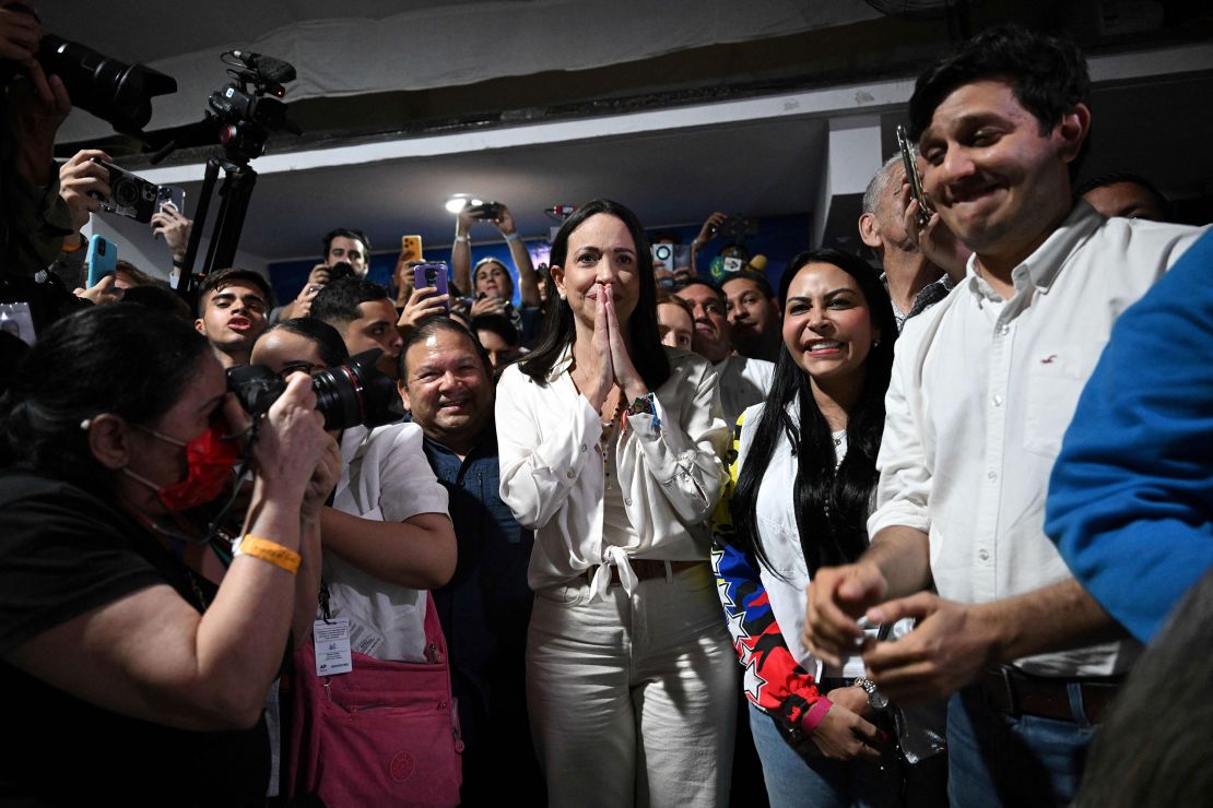 Venezuelan presidential pre-candidate for the opposition Vente Venezuela party, Maria Corina Machado (C) celebrates the results of the opposition's primary elections at her party headquarters in Caracas on October 22, 2023. Venezuela's opposition is voting in primaries that will select a candidate to face President Nicolas Maduro in the elections next year. (Photo by Federico PARRA / AFP) (Photo by FEDERICO PARRA/AFP via Getty Images)