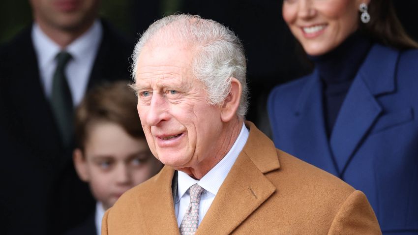 Britain's King Charles III waits on the church steps after attending the Royal Family's traditional Christmas Day service at St Mary Magdalene Church on the Sandringham Estate in eastern England, on December 25, 2023. (Photo by Adrian DENNIS / AFP) (Photo by ADRIAN DENNIS/AFP via Getty Images)
