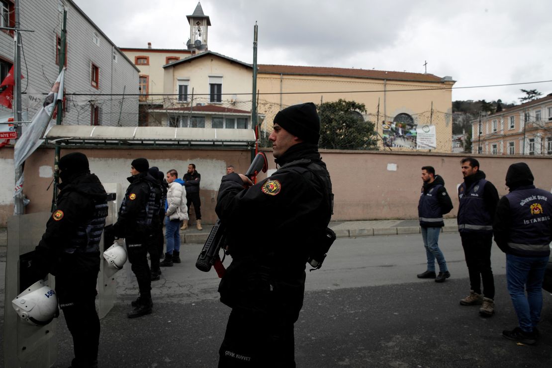 Turkish police stand guard outside the Italian Santa Maria Catholic Church after two masked gunmen shot one person dead during Sunday service, in Istanbul, Turkey January 28, 2024.