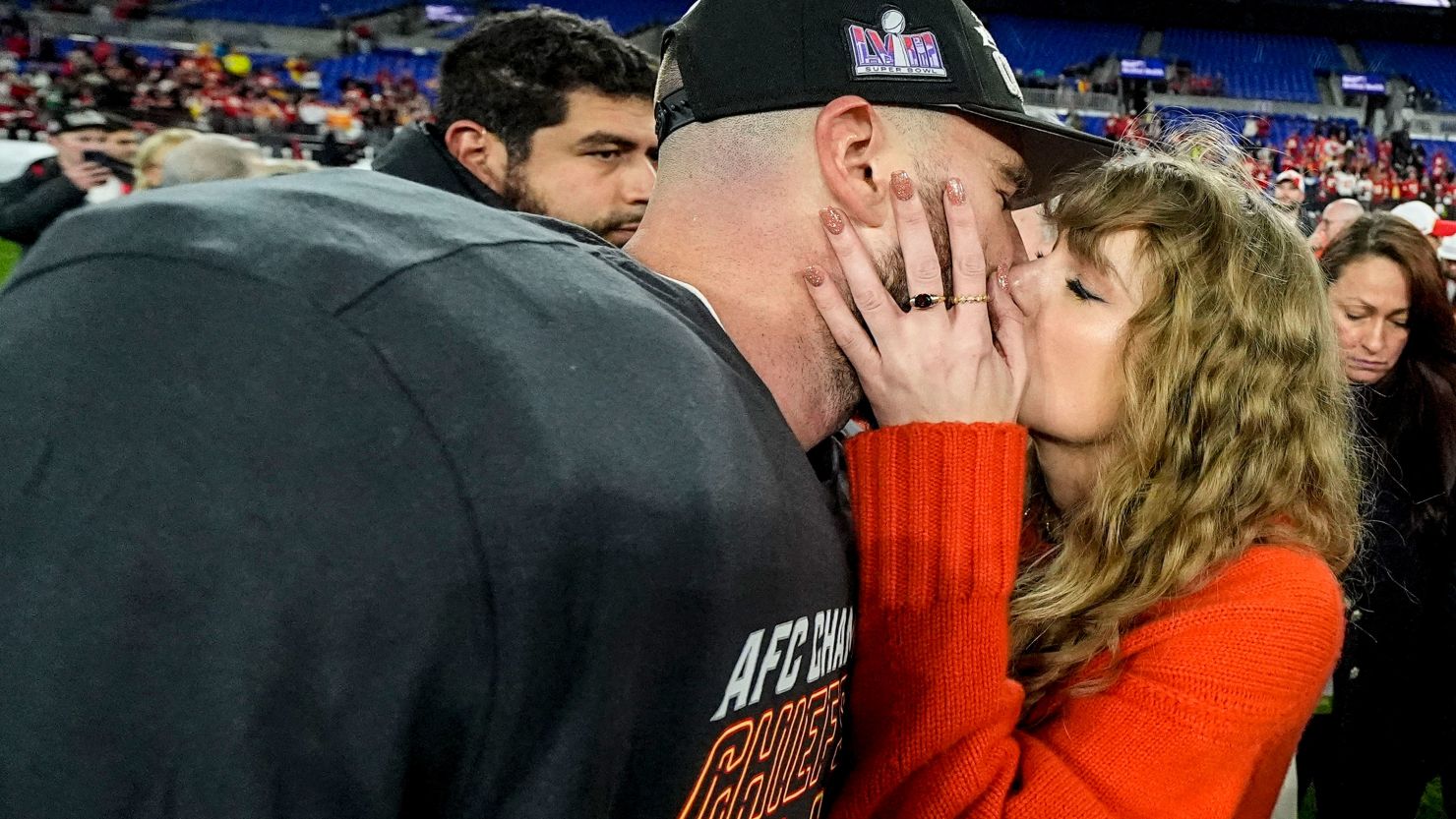 Taylor Swift kisses Kansas City Chiefs tight end Travis Kelce after an AFC Championship NFL win against the Baltimore Ravens, Sunday, Jan. 28, 2024, in Baltimore. 