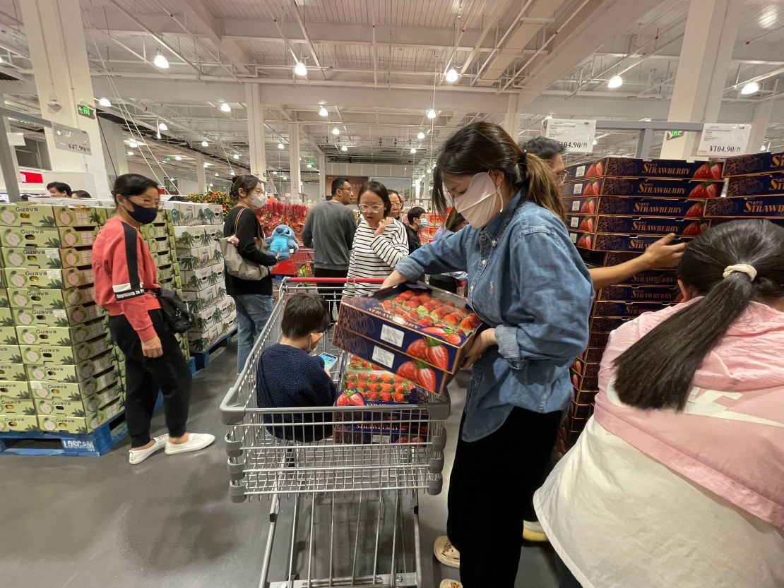 Shoppers snatch up food products at recently opened Costco in Shenzhen.