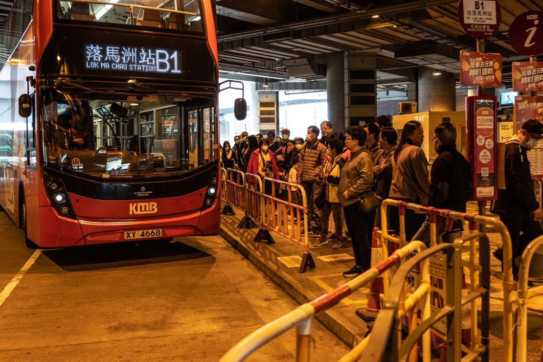 People line up at Yuen Long station for cross-border buses to mainland, in Hong Kong, China on January 21, 2024.