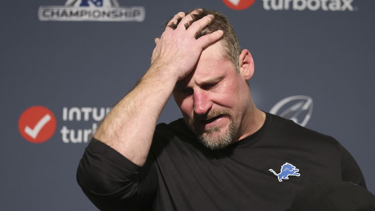 Detroit Lions head coach Dan Campbell reacts while speaking at a news conference after the NFC Championship NFL football game against the San Francisco 49ers in Santa Clara, Calif., Sunday, Jan. 28, 2024. (AP Photo/Jed Jacobsohn)