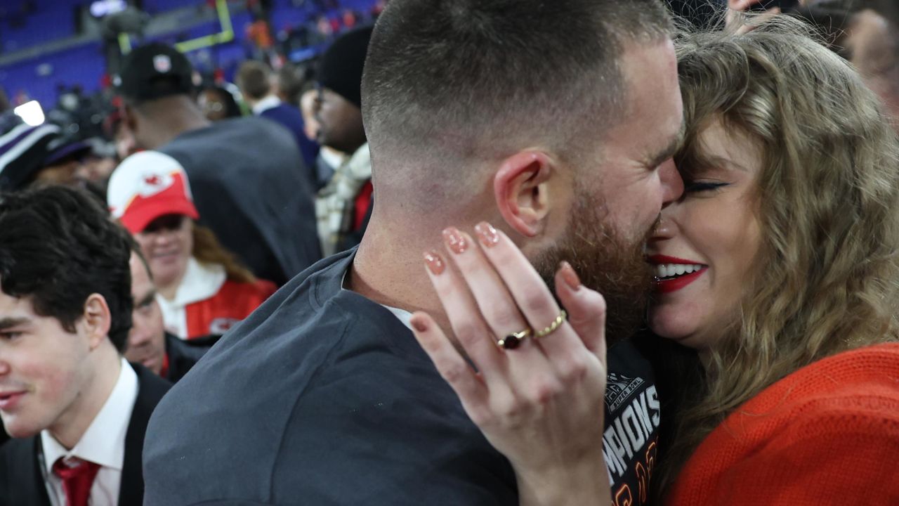 BALTIMORE, MARYLAND - JANUARY 28: Travis Kelce #87 of the Kansas City Chiefs embraces Taylor Swift after a 17-10 victory against the Baltimore Ravens in the AFC Championship Game at M&T Bank Stadium on January 28, 2024 in Baltimore, Maryland. (Photo by Patrick Smith/Getty Images)