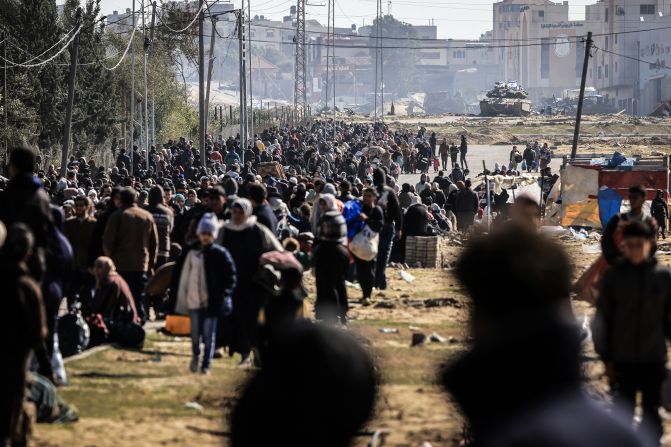 An Israeli tank takes position at the western entrance of the Khan Younis refugee camp in Gaza as Palestinians flee to safer areas further south on January 26.