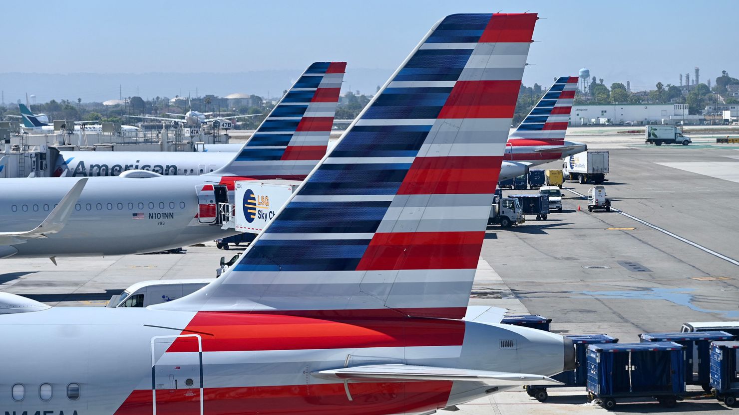 American Airlines planes sit at the gate at Los Angeles International Airport (LAX) in Los Angeles, California, on July 26, 2023. (Photo by Daniel SLIM / AFP) (Photo by DANIEL SLIM/AFP via Getty Images)