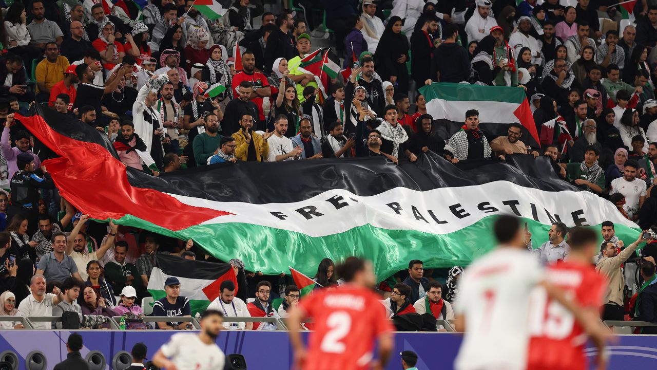 AL RAYYAN, QATAR - JANUARY 14: Fans display a 'Free Palestine' flag during the AFC Asian Cup Group C match between Iran and Palestine at Education City Stadium on January 14, 2024 in Al Rayyan, Qatar. (Photo by Robert Cianflone/Getty Images)