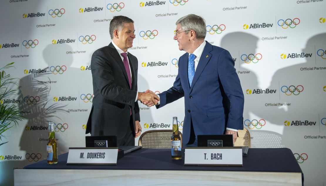 AB InBev CEO Michel Doukeris and IOC President Thomas Bach shake hands as they attend the International Olympic Committee And AB Inbev announcement for a Worldwide Olympic Partnership at Palm House Victoria on January 12, 2024 in London, England.