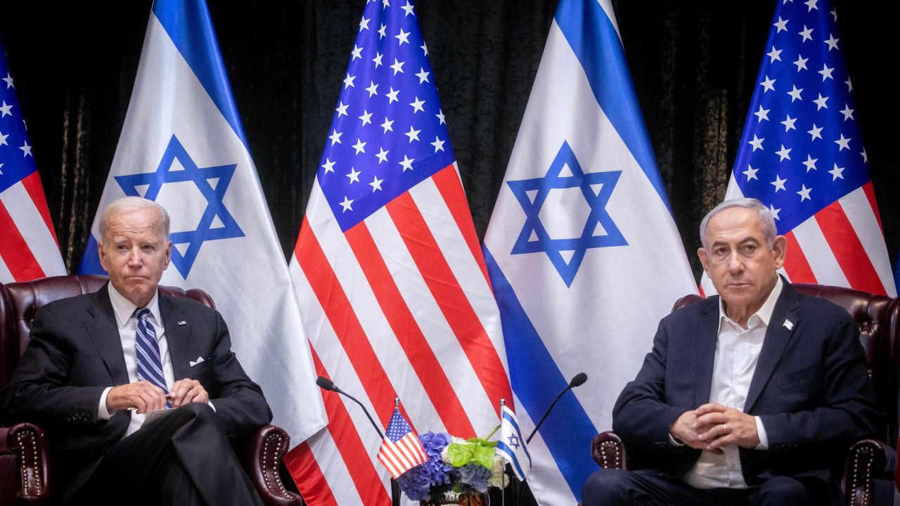 US President Joe Biden (L), sits with Israeli Prime Minister Benjamin Netanyahu, at the start of the Israeli war cabinet meeting, in Tel Aviv on October 18, 2023, amid the ongoing battles between Israel and the Palestinian group Hamas. US President Joe Biden landed in Tel Aviv on October 18, 2023 as Middle East anger flared after hundreds were killed when a rocket struck a hospital in war-torn Gaza, with Israel and the Palestinians quick to trade blame. (Photo by Miriam Alster / POOL / AFP) (Photo by MIRIAM ALSTER/POOL/AFP via Getty Images)