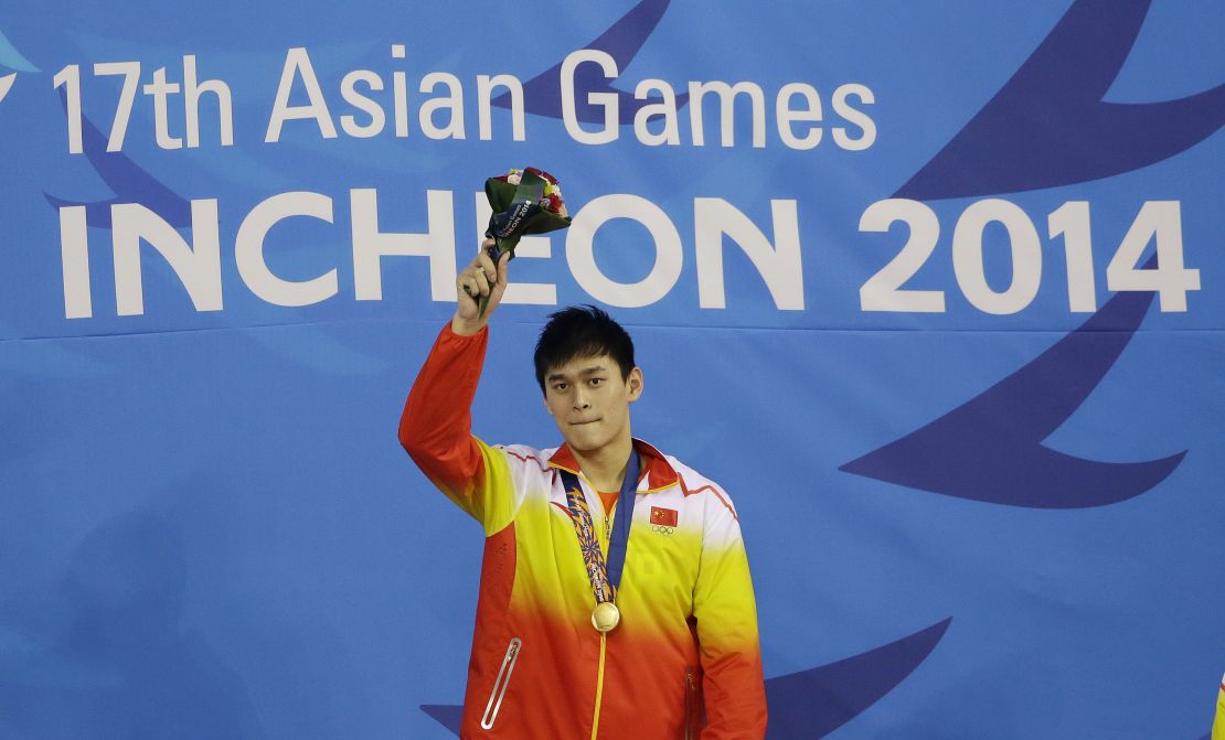 China's Sun Yang waves after receiving his gold medal in the men's 1500-meter freestyle swimming final at the 17th Asian Games in Incheon, South Korea, Friday, Sept. 26, 2014.