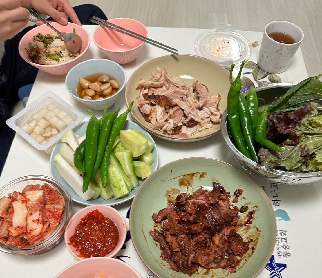 North Korean refugee, who was trafficked into forced marriage in China and lived there for a long time before escaping to South Korea, eats her meal at her home in South Korea.