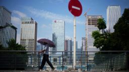 A man walks past a No Entry traffic sign near the headquarters of China Evergrande Group in Shenzhen, Guangdong province, China September 26, 2021.