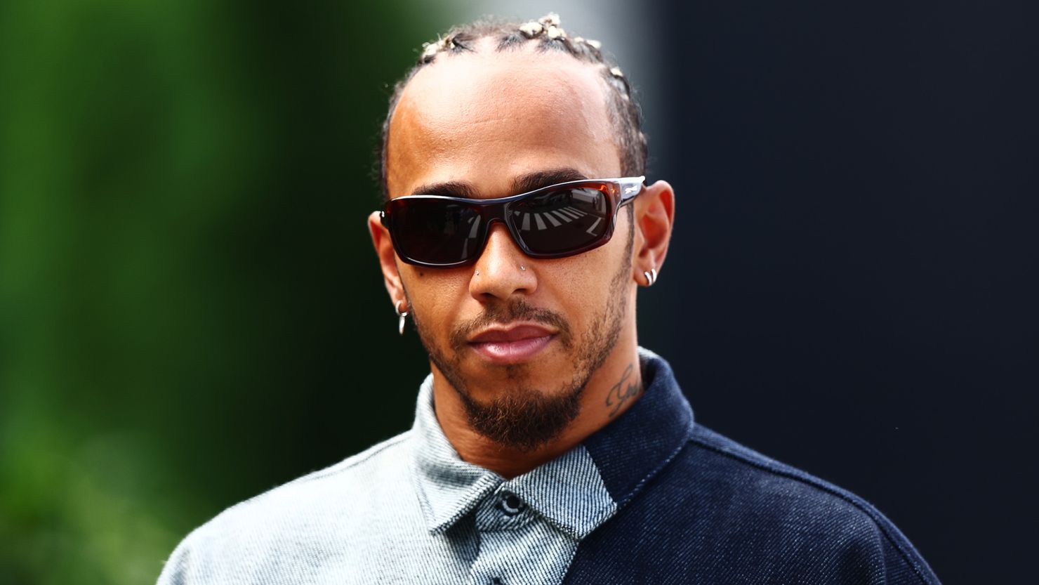 SUZUKA, JAPAN - SEPTEMBER 22: Lewis Hamilton of Great Britain and Mercedes walks in the Paddock prior to practice ahead of the F1 Grand Prix of Japan at Suzuka International Racing Course on September 22, 2023 in Suzuka, Japan. (Photo by Clive Rose/Getty Images)