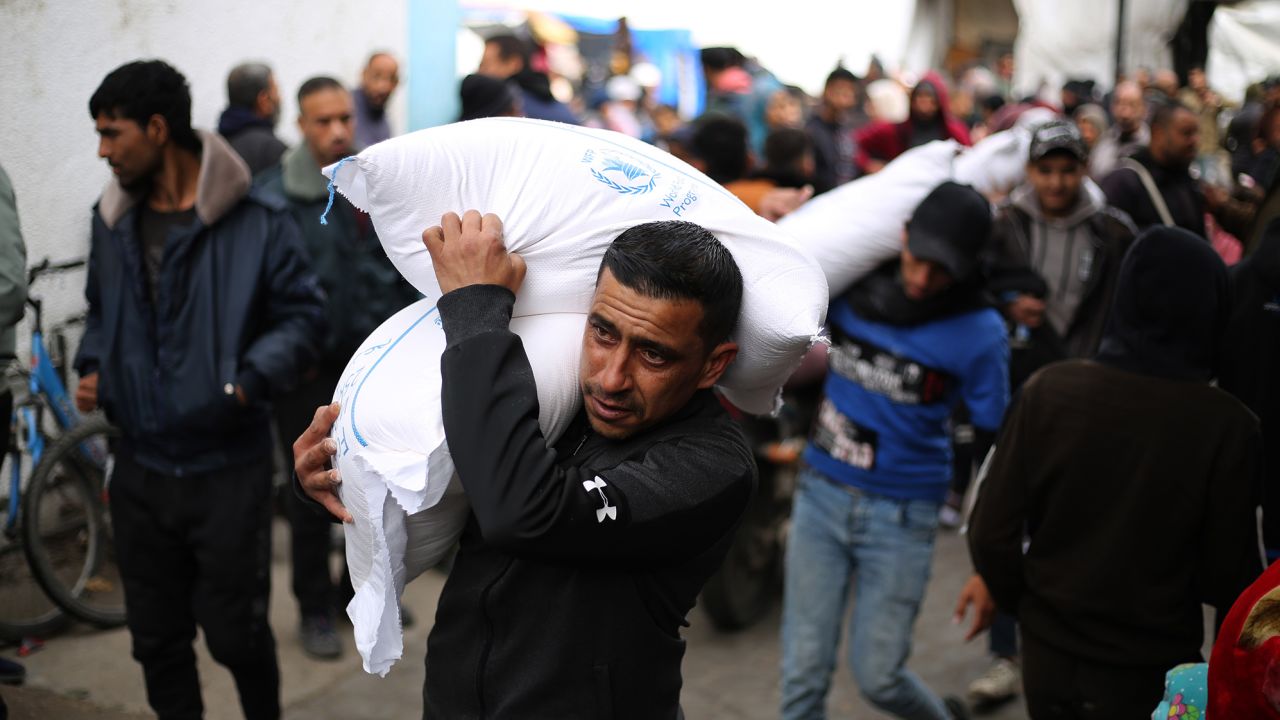 A man carries relief supplies provided by the United Nations Relief and Works Agency for Palestine Refugees UNRWA in the southern Gaza Strip city of Rafah, Jan. 28, 2024. Funding suspension would force UNRWA to halt all its activities in the conflict-ridden Gaza Strip in a few weeks, the UN relief agency's commissioner-general said Sunday. The United States, Canada, Britain, Germany, Australia, Finland, and the Netherlands decided to pause funding to UNRWA after Israel accused several UNRWA employees of suspected involvement in the Oct. 7 attack on Israel last year. (Photo by Khaled Omar/Xinhua via Getty Images)