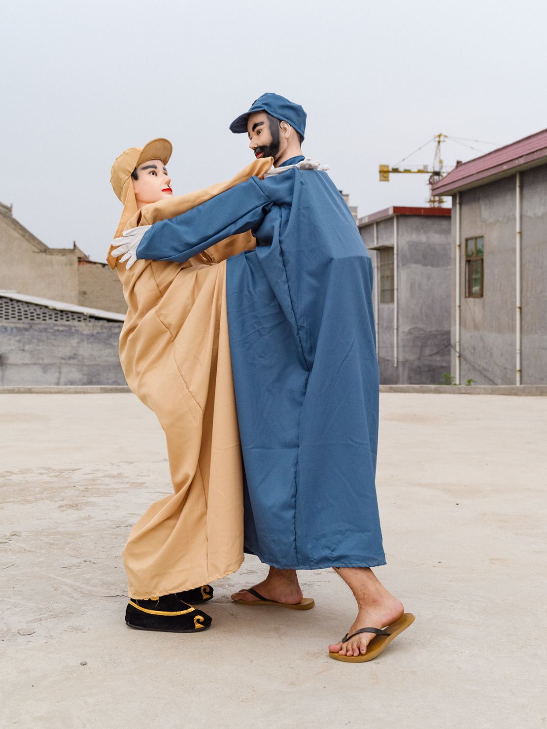 Shehuo performers wrestle, reenacting their on-stage scene as soldiers of the Chinese Eighth Route and Japanese armies, Huozhuang Village, Henan Province, 2018; from Community Fire (Aperture, 2023).