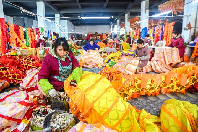 Workers assemble dragon lanterns at a production workshop in Nanchang, Jiangxi Province, China on January 24.