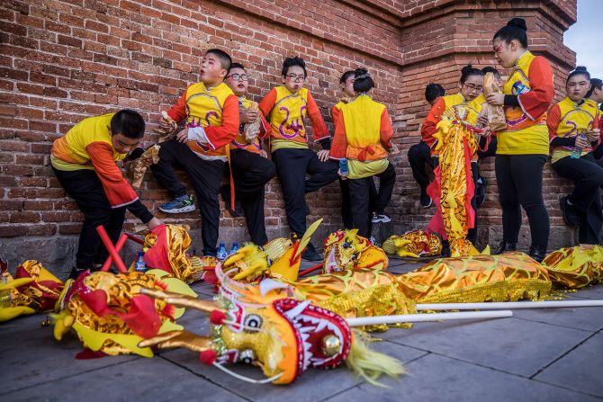 Dragon dance performers take a quick break during the Lunar New Year Parade in Barcelona, Spain on February 3.
