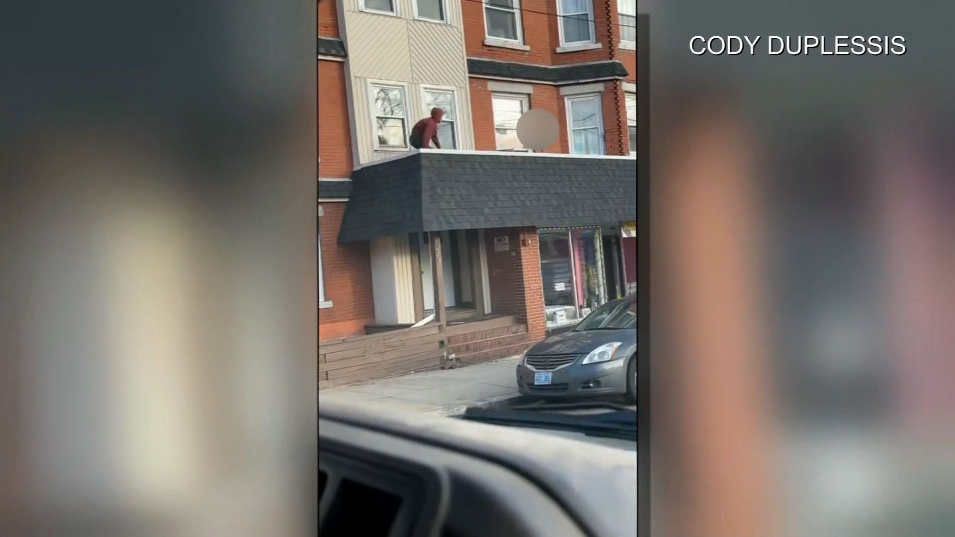 Man springs into action after seeing an unaccompanied toddler on roof