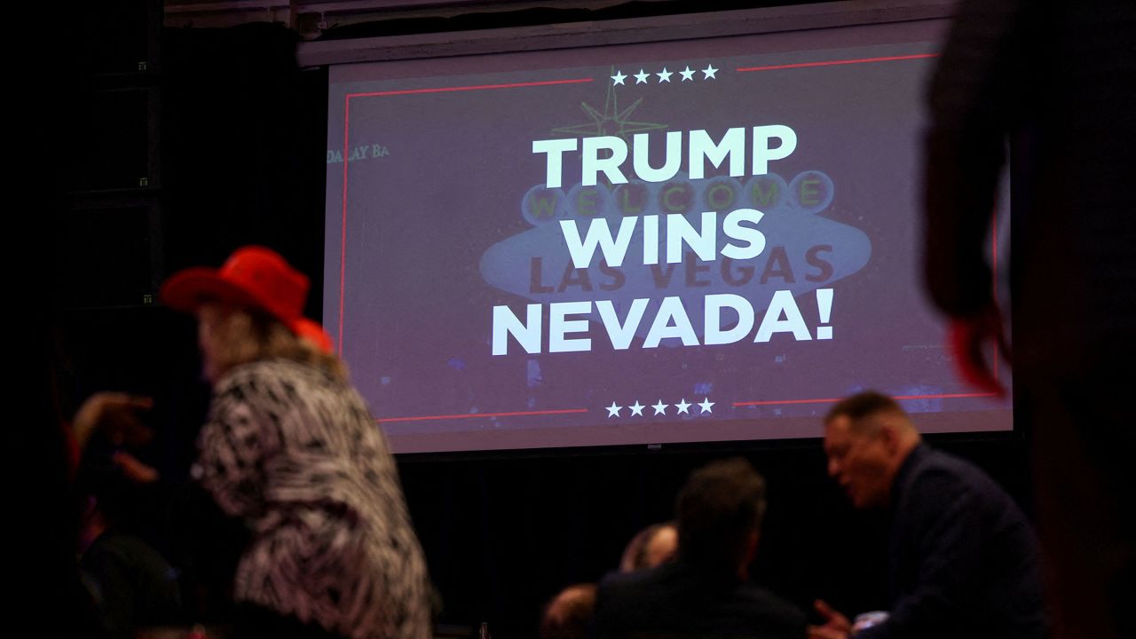 A screen displays "Trump wins Nevada", during a Nevada caucus night party for Republican presidential candidate and former U.S. President Trump at Treasure Island Resort & Casino in Las Vegas, Nevada, on Thursday, February 8, 2024.