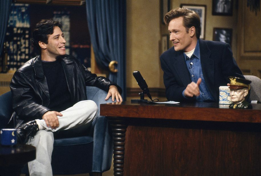 Stewart is interviewed by late-night TV host Conan O'Brien in 1993. Stewart held various jobs after college but eventually gravitated to stand-up comedy. In 1993, he also got his own talk show, "The Jon Stewart Show," which aired on MTV.