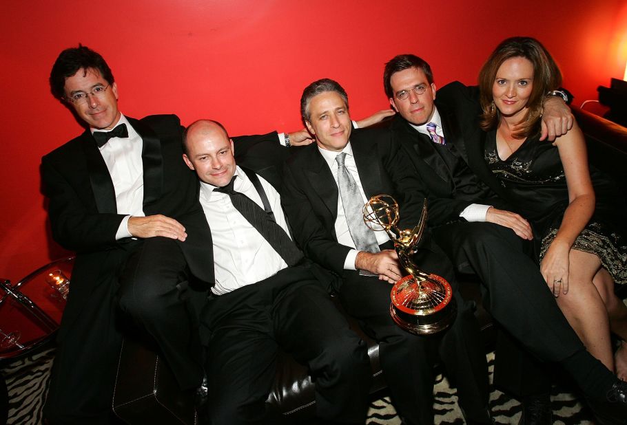 Stewart sits between some of his "Daily Show" co-stars — from left, Colbert, Rob Corddry, Ed Helms and Samantha Bee — at an Emmys afterparty in 2005.